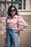 Light pink cotton blouse with pearlised buttons and broderie detail throughout. Long sleeves and delicate threadwork make this an usual premium blouse